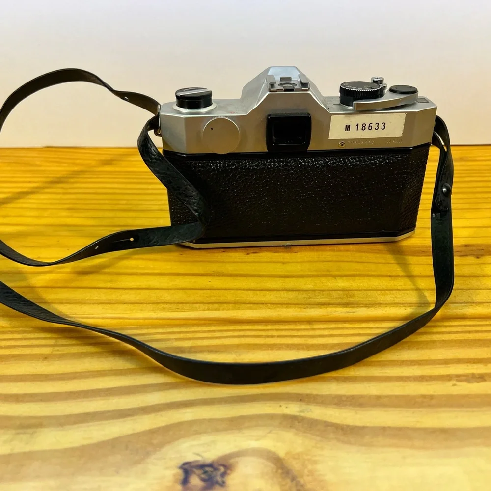 Yashica Black and Silver Film Camera with Rangefinder Design‎